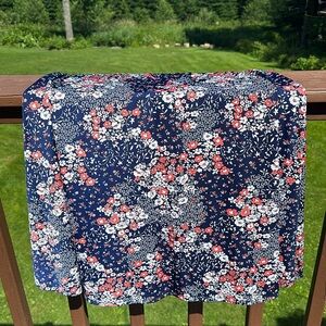 Navy blue mid length skirt with coral and white flowers. Xl